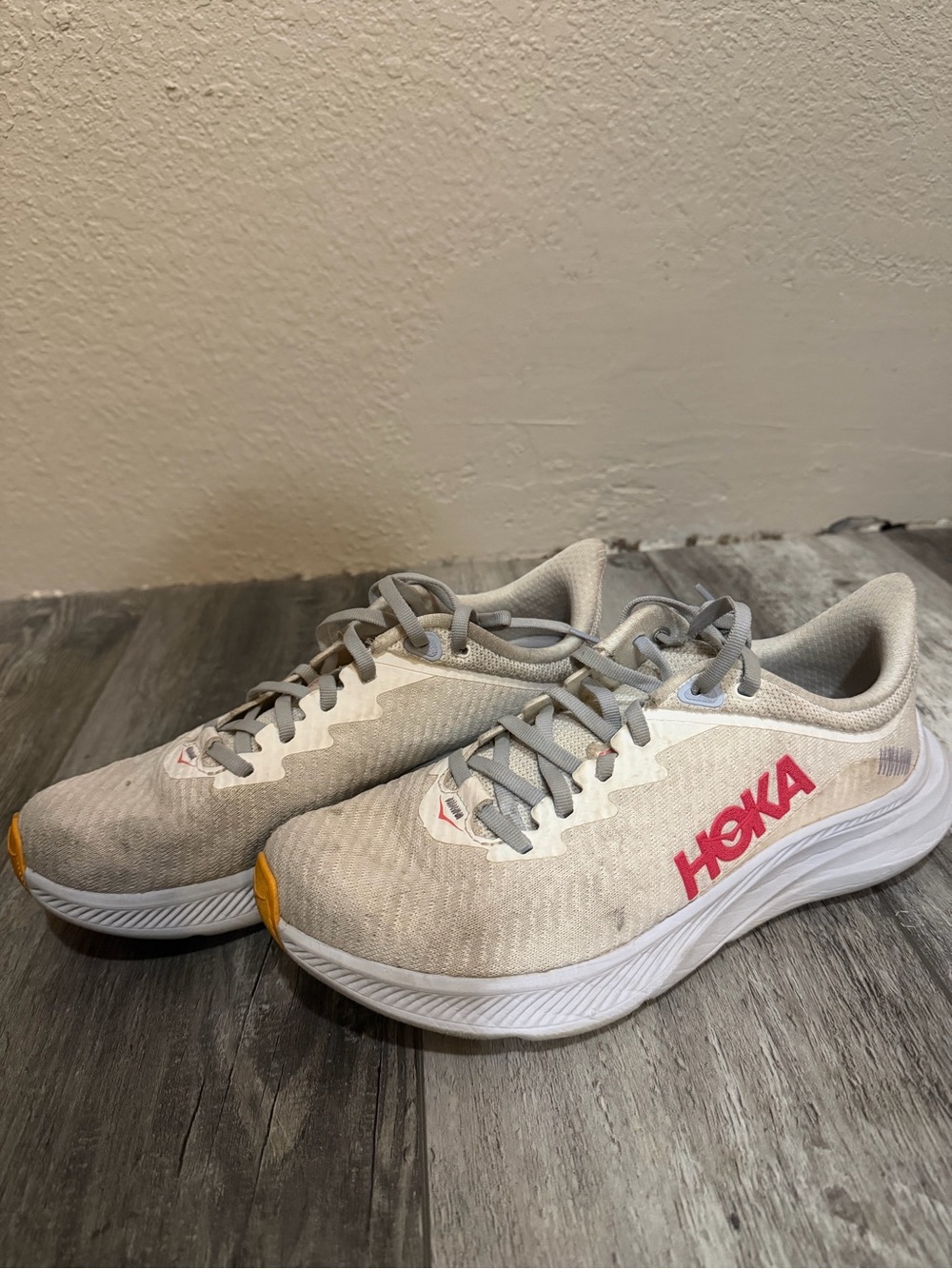 Hoka Solimar Neutral Gray Running Shoes with Pink Logo and Yellow Toe Accents